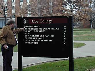 Independent Living Specialist Jim Whalen tries to find his way around campus using this sign (which baffles many visitors).